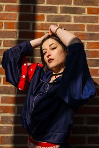 Portrait of brown haired model holding her hair