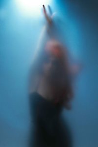 Blue silhouette portrait with faint model features