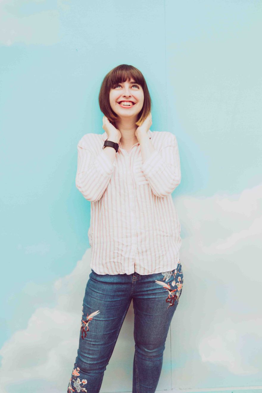 Life of lilly blogger portrait in front of sky backdrop