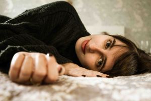 Close up portrait of Life of Lilly led on her bed