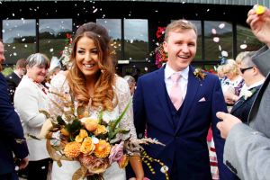 wedding portrait of bride and groom with confetti