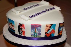 Heart shaped wedding cake with film themes around the edge