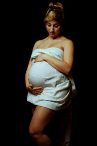 Mother holding her baby bump