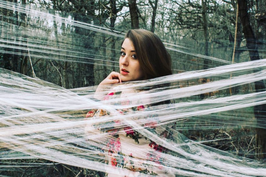 Self portrait of myself hidden behind clingfilm in a forest