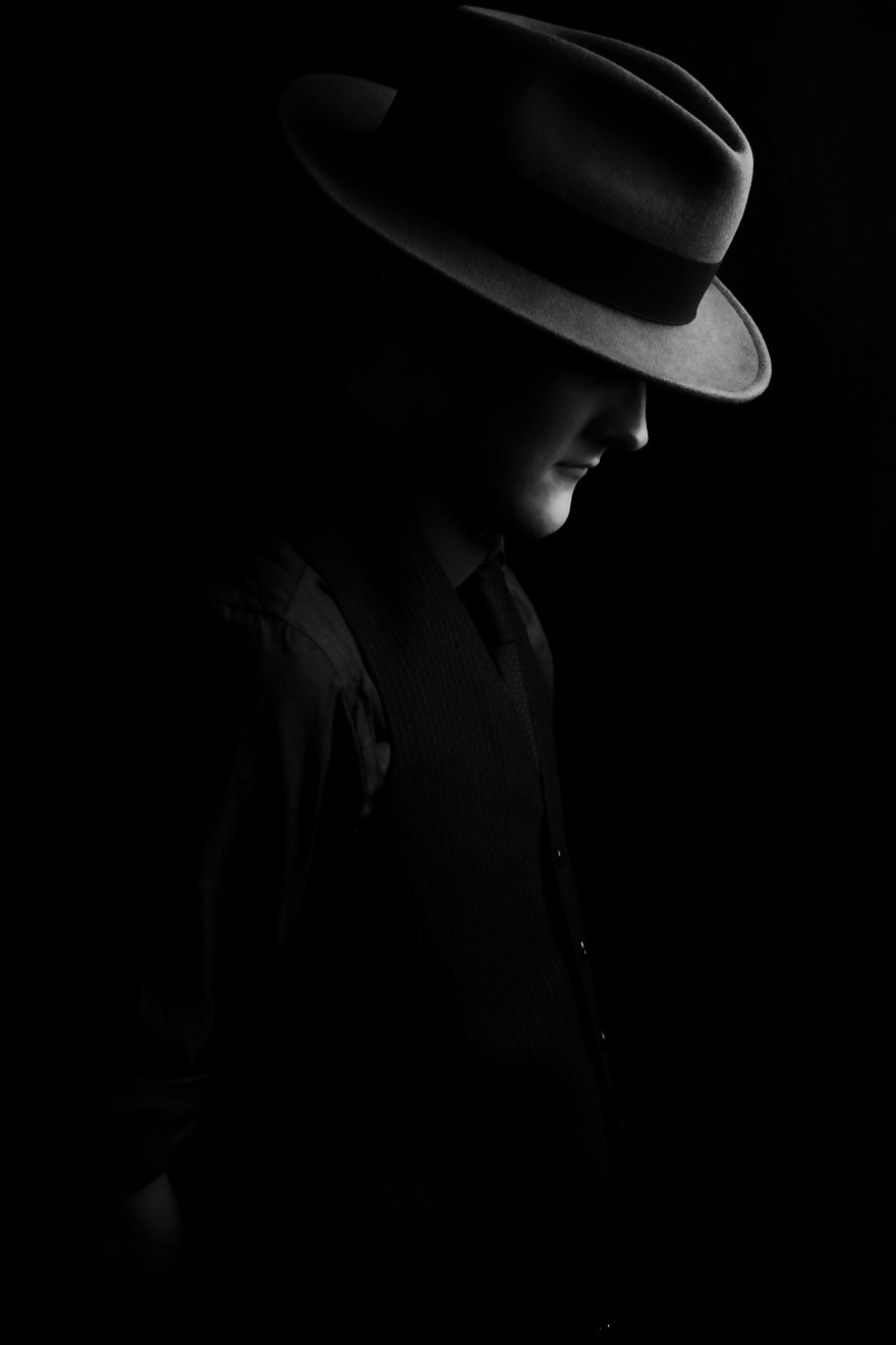 Low key portrait of man with fedora