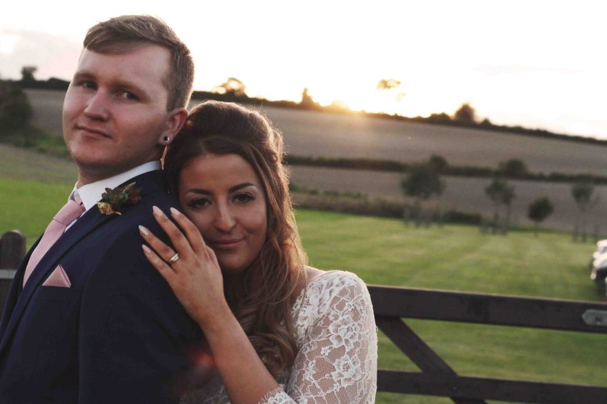 wedding sunset portrait with bride and groom
