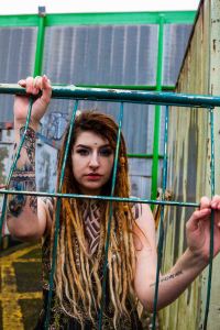model with dreadlocks portrait with railings