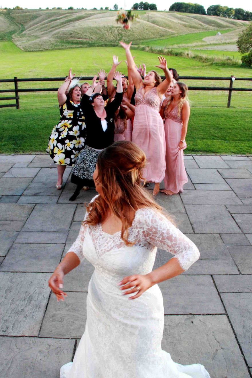 Bride throwing her bouquet