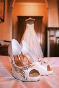 wedding dress photo with shoes in front of it