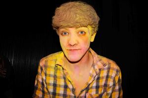 Powder paint male portrait with yellow paint