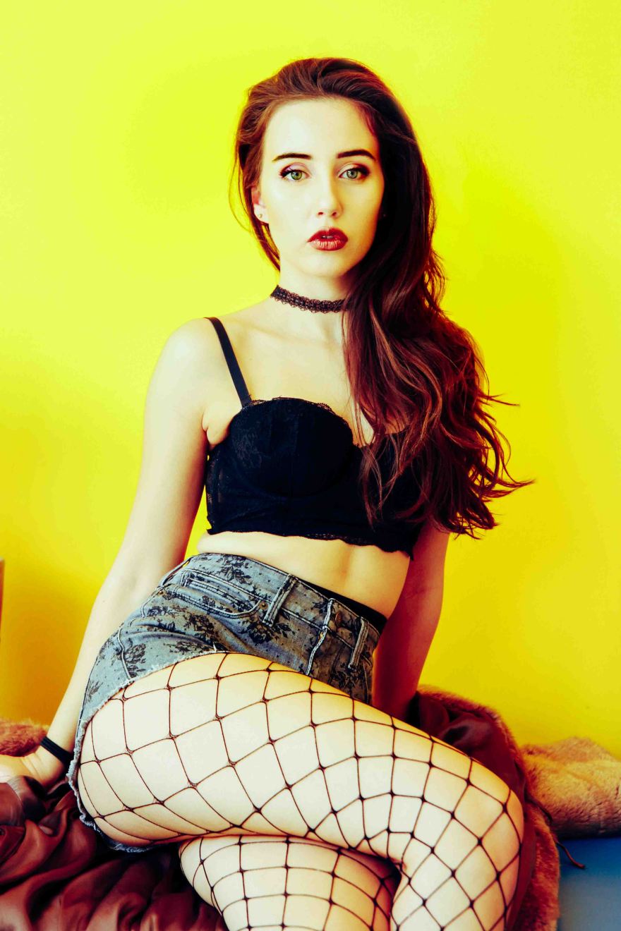 Colourful portrait with yellow background in laundrette