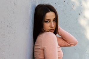 Close up portrait of model against white wall