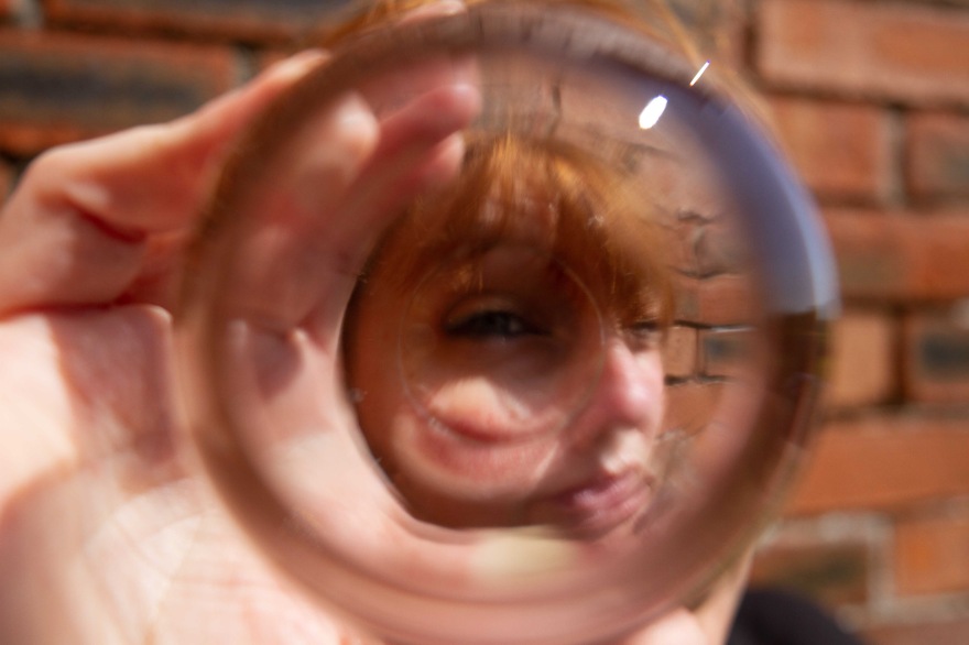 Abstract portrait of woman through a glass