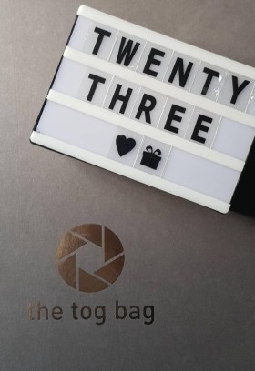 twenty three flat lay with the tog bag
